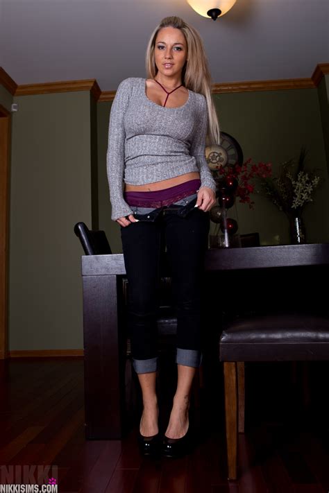 clothed amateur nikki sims takes off her sweater and jeans in a teasing manner