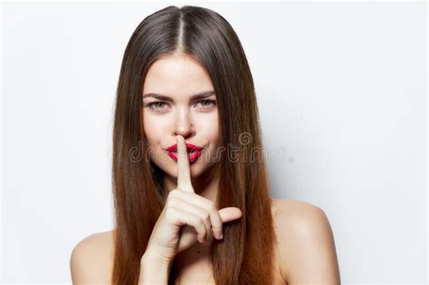 Woman Holds His Finger Near His Lips And Classified Information Clear