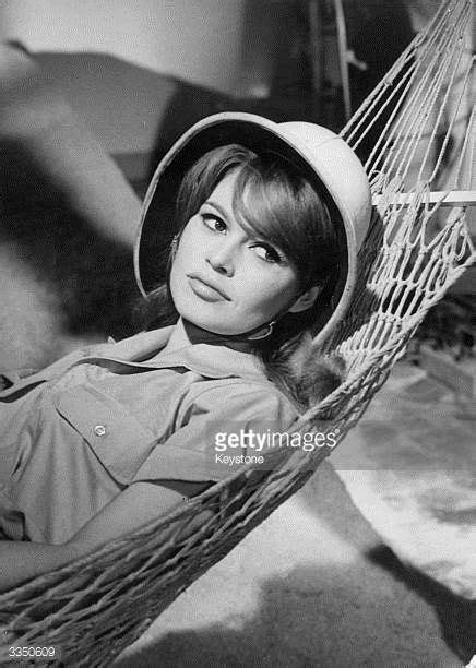 Brigitte Bardot Wears A Topee As She Reclines In A Hammock