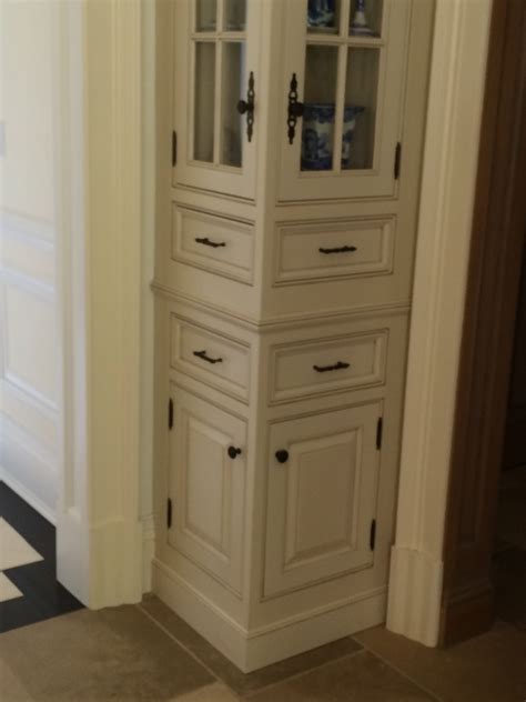 tall narrow corner cabinet