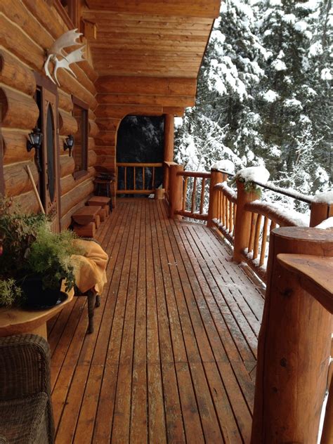 covered cabin porch   porch  wonderful place    snow log homes log home