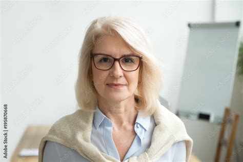 Confident Aged Businesswoman Wearing Glasses Looking At Camera Skilled