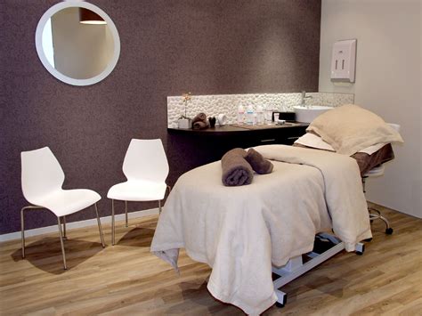 spa room one dark accent wall esthetician room massage therapy rooms