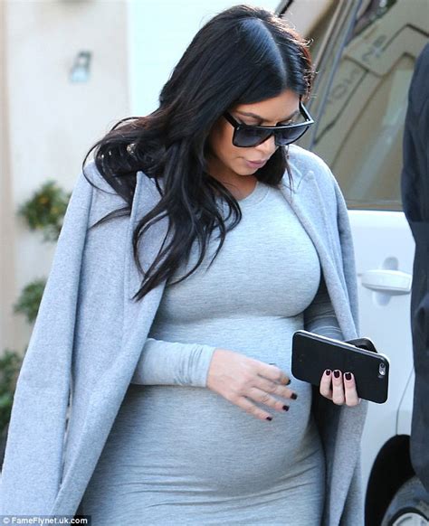 Eight Months Pregnant Kim Kardashian Wears A Skintight Dress And Heels