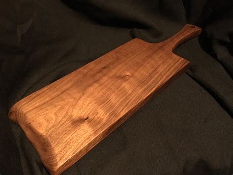 buy hand crafted wood paddle style cutting board  handle