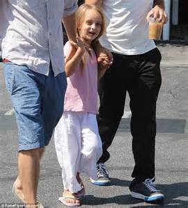tobey maguire keeps iced drink in hand as he steps out for lunch with wife and daughter daily