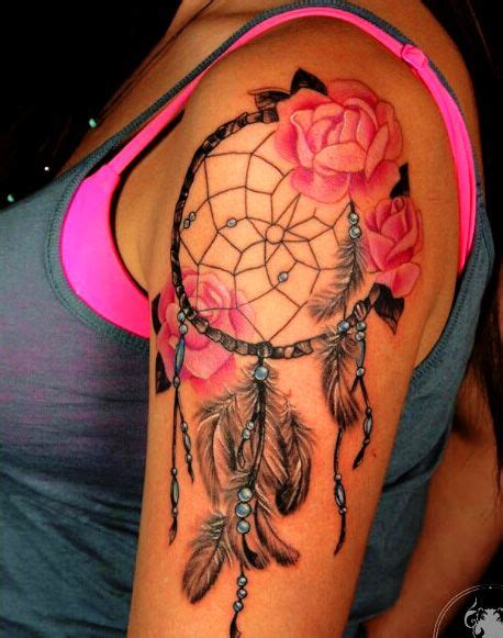 dreamcatcher and flower on arm colorful weird tattoos tattoos dream catcher tattoo