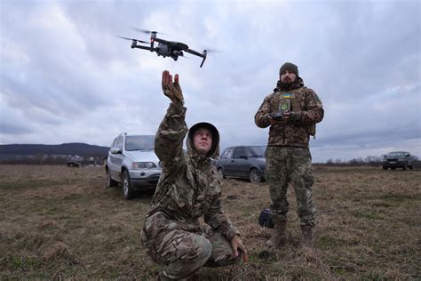 video shows ukraine drone drop grenades  unsuspecting russians