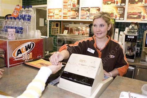 teen working  cashier     fast food restaurant saskatoon lone pine photo
