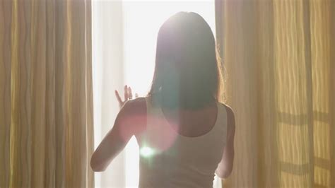 Woman Opens Curtains Gazes Out Window Stock Footage Sbv 336921179