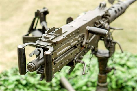 Closeup And Back View Of M2 50cal Browning Machine Gun With Tripod