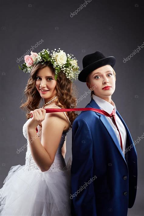 hermosa pareja de lesbianas en trajes de boda — foto de stock © wisky 66360843