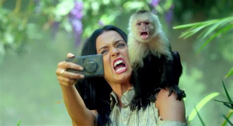 katy perry goes on selfie rampage in the jungle in roar music video metro news