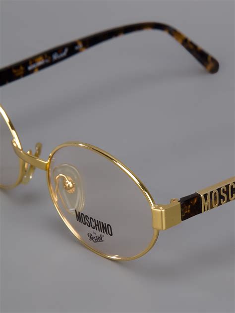 lyst moschino round frame glasses in metallic