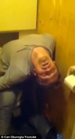 drunk russian man falls asleep bent over backwards in