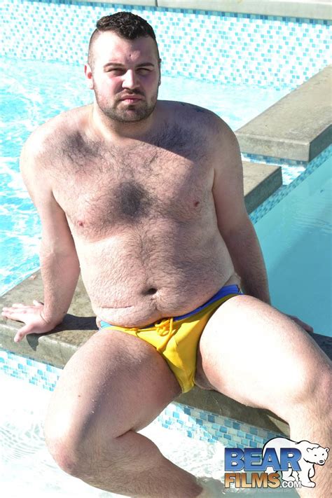 solo bear rex blue sits by the pool in his skimpy swimsuit and jerks off