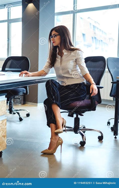 business woman sitting     desk stock image