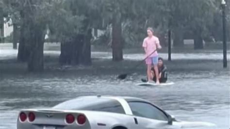 hurricane ian orlando residents paddle board  flooded streets  news sky news