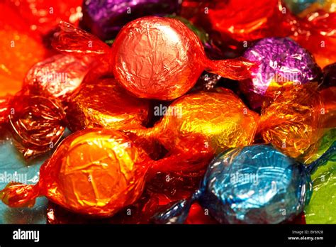 pile  wrapped  chocolate sweets  colourful wrappers stock photo