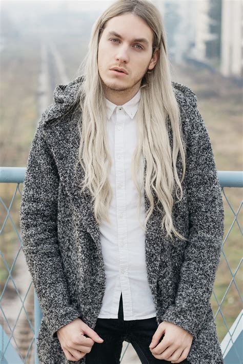 handsome male model  long blond hair del colaborador de stocksy