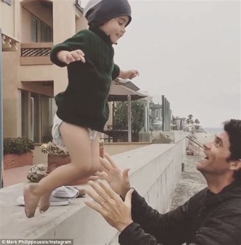 mark philippoussis dotes on his cherubic lookalike son nicholas with wife silvana daily mail