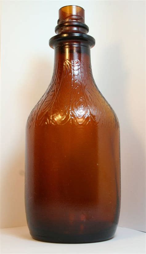 Vintage Brown Glass Bottle With Beautiful Detail Mfd By Nolakitsch