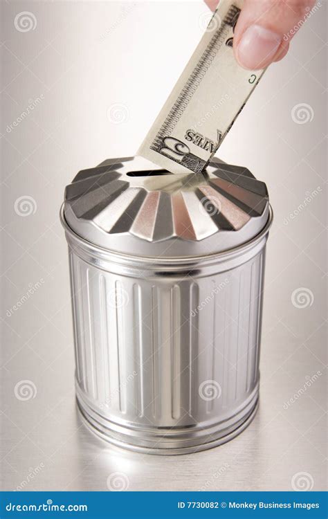 wasting money stock photo image  dustbin currency