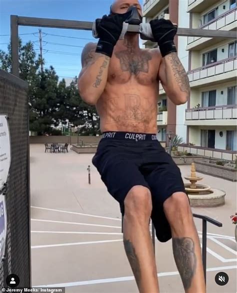 jeremy meeks displays his ripped physique as he performs shirtless pull