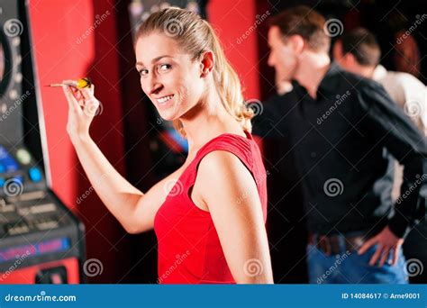 group  friends playing darts royalty  stock photography image