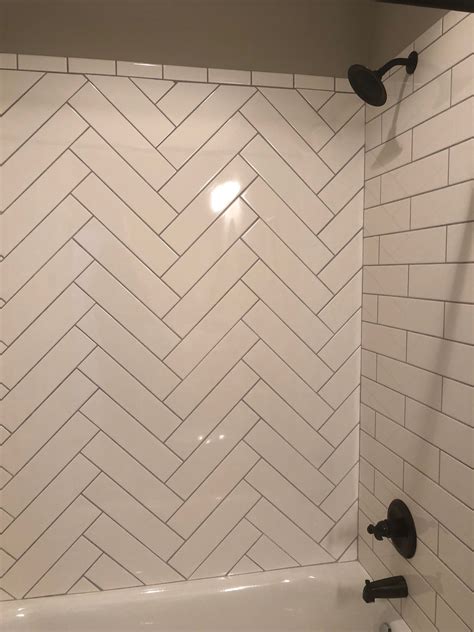 stunning herringbone pattern  white subway tile