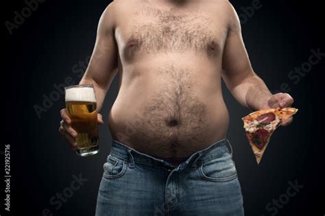 a fat man in jeans with saggy fat on the sides and a hairy belly