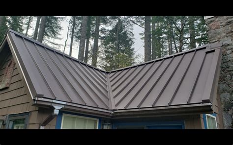 installing gutters  metal roof mountaintop metal roofing