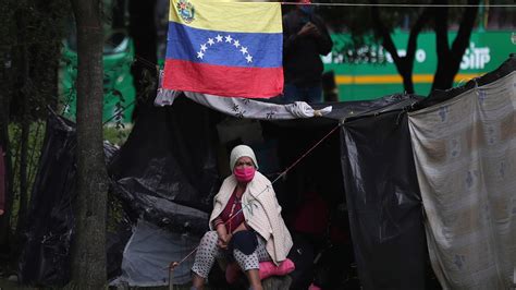 stranded venezuelans build camp in colombia amid pandemic 8news