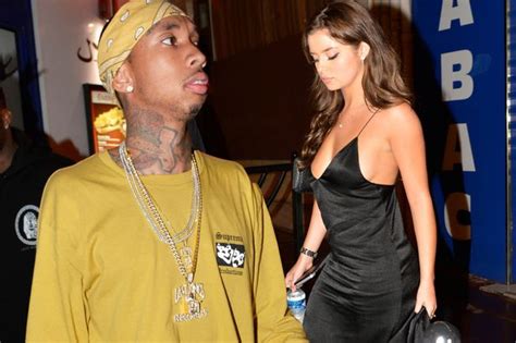 tyga ignores sex tape drama as he parties with his new girlfriend