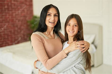 Premium Photo Loving Latin Mother And Daughter Hugging Each Other
