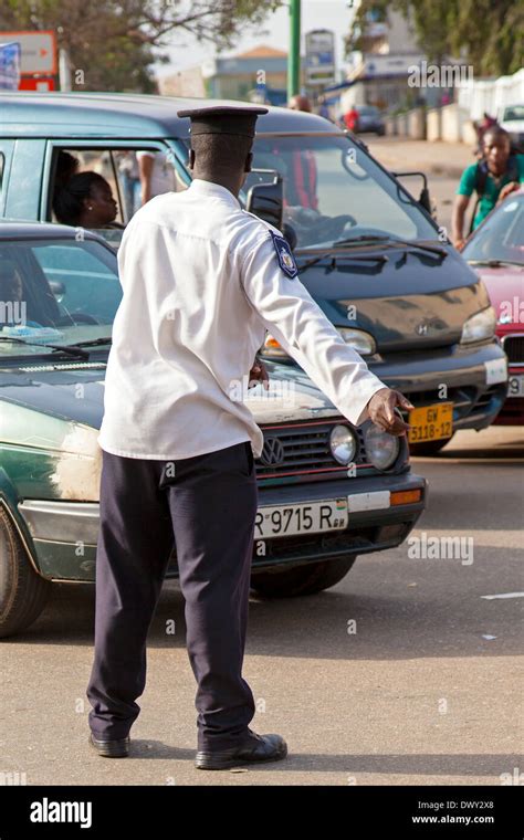 police directing traffic at makola market accra ghana africa stock