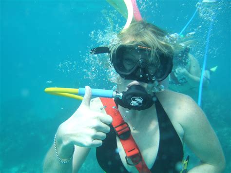 happy snuba diver    breath underwater scuba girl