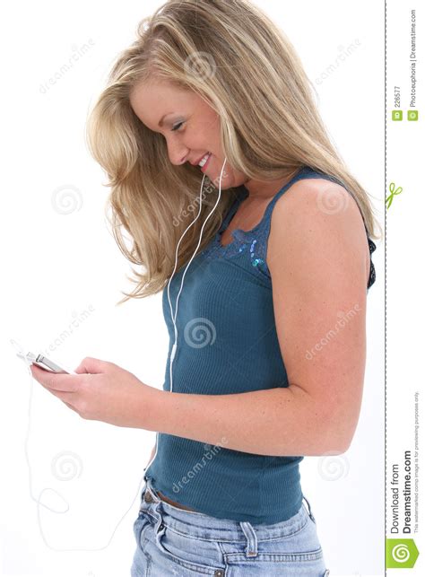 blonde teen girl listening to music stock image image of jeans adult 226577