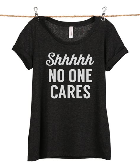 take a look at this heather black shhh no one cares scoop neck tee