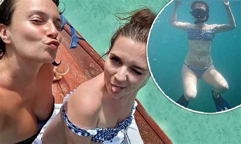 candice brown shows off her toned figure in a tiny blue gingham bikini