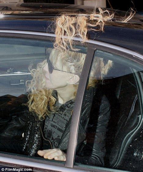 courtney love has a bad hair day as her unruly mop takes flight in the