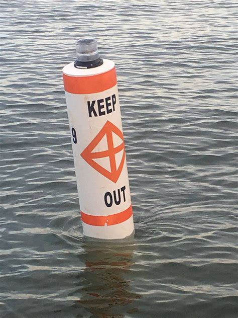 lighted buoy shown  warn boaters  navigation hazards