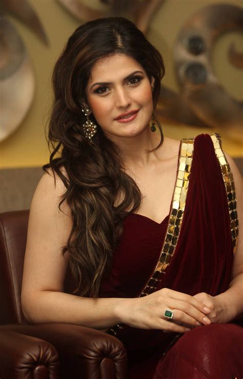 zarine khan hot photos in red saree at indian wedding lounge event