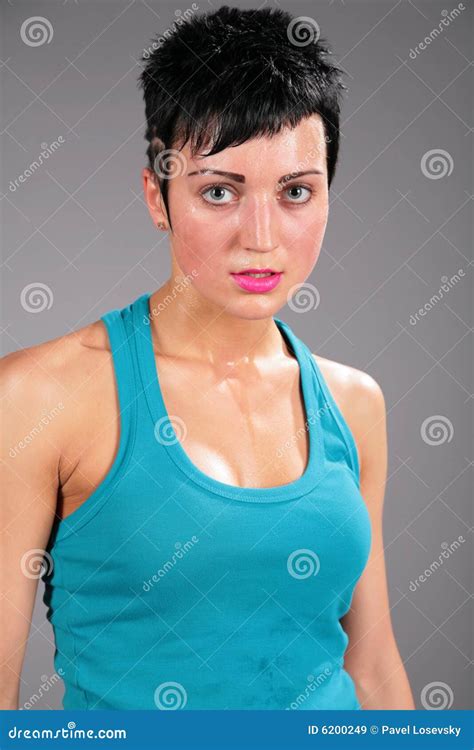 Young Sweaty Strong Muscular Fit Girl Hands Holding Heavy Kettlebell On