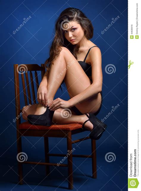 Beautiful Naked Woman In Black Panty Sitting On The Chair
