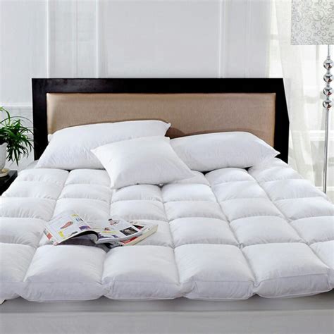 luxury  feather mattress comforter  hotel guests petop hotel
