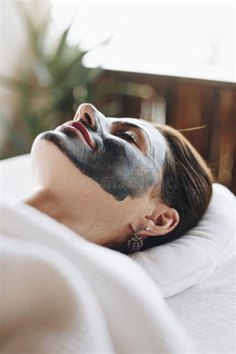 Woman Relaxing With A Facial Mask At The Spa Stock Image Image Of