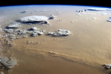 massive sandstorm covering  sahara desert   space