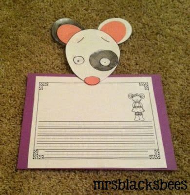 paper cut    mouse holding  sheet  paper  writing