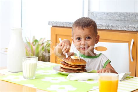 kid eating pancakes stock photo royalty  freeimages